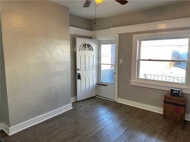 Living room with new front door and storm door