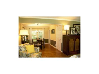 The living room is open to the formal dining room.
