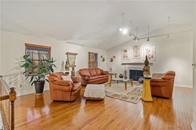 Warm and cozy living room with gleaming wood floor