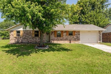 Ranch-style house with brick siding, concrete driveway, and a garage