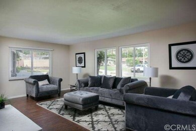 The light & bright, open living room is the first 