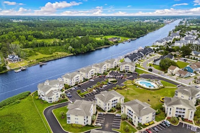 Aerial perspective of suburban area with a nearby body of water