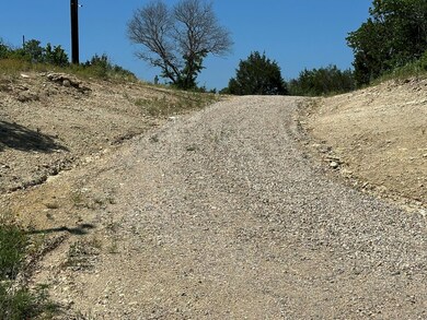 Gravel drive into property.