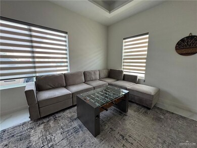 Living area featuring baseboards