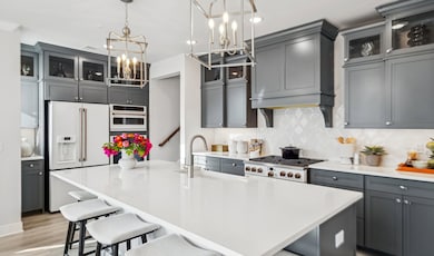 Kitchen with upper glass cabinetry