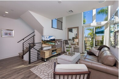 Expansive view windows flood this living room with