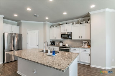 Upgraded countertops and a large island with Moen