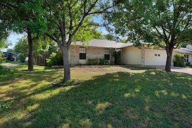 View of front of house featuring concrete drivewa