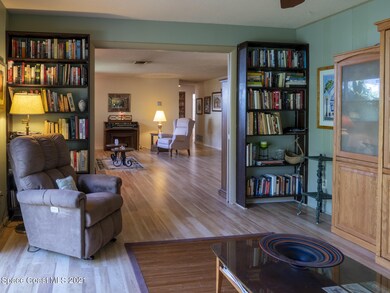den peeking into living room
