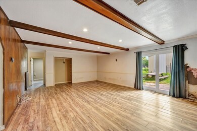 This spacious living area features wood-look floor