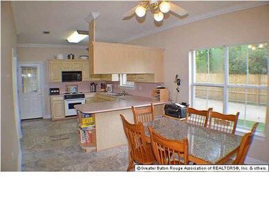 Spacious kitchen opens to the dining area with tra