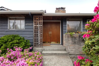 Fresh exterior paint and mature plantings. 