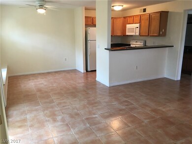 View of living room, dining room and kitchen.  Cer