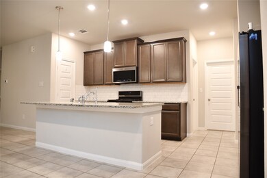 Pendant lighting above the kitchen island