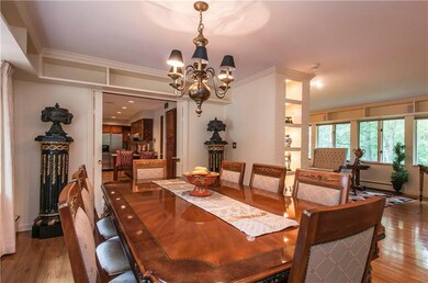 The elegant dining room is open to the kitchen or 