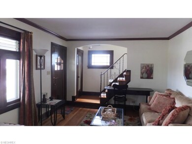 All natural woodwork and crown moldings in Living Room & Dining Room !