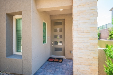 Doorway to property with stucco siding