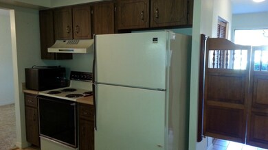 Space saving kitchen flows into the dining area,th