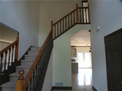 Stairs featuring a high ceiling