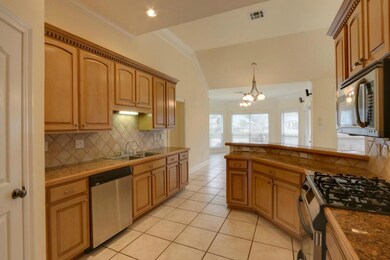 Super kitchen offers loads of maple cabinetry.