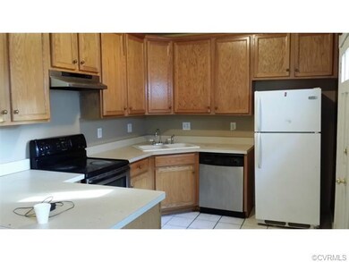 Newer kitchen, with tile floors and lots of cabine