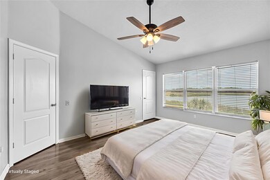 Upstairs you find the large owners’ suite featuring breathtaking water views, durable laminate flooring, walk-in closet, and en-suite bathroom.