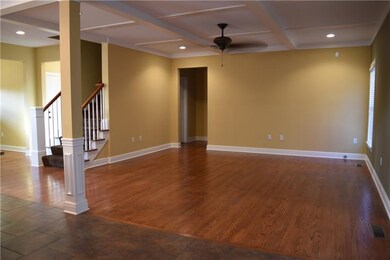 Gorgeous solid oak flooring.  Coffered ceiling wit