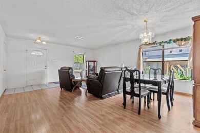 Dining room featuring a chandelier, light wood fi