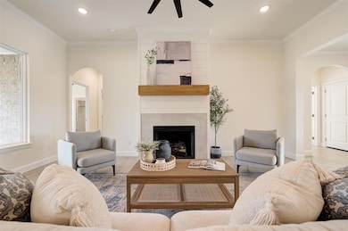 Living room with high ceilings and a statement fireplace.