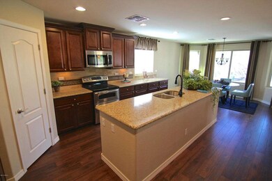 Kitchen w/ Granite Slab & Stainless Apps