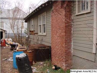 Left side of house with AC unit