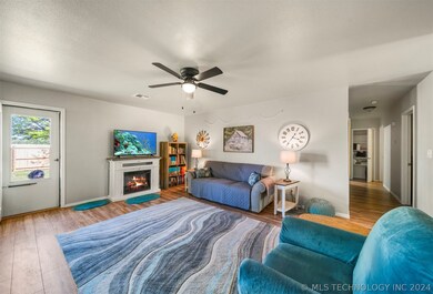 Open living room.  Fireplace stays!