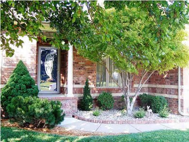 The front porch is covered to shelter guests. Note