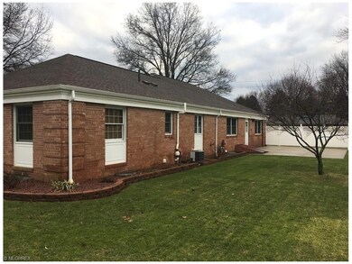 Back view of home and patio with privacy fence on 