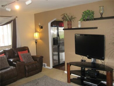 The living room opens into the kitchen.