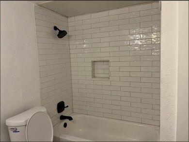 Full bathroom featuring shower / bathtub combinati