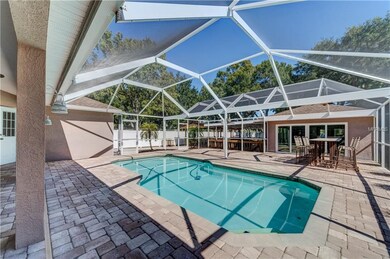 The screened-in pool area is just the beginning of