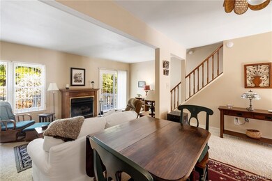 Dining Room opens to Living Room with Fireplace