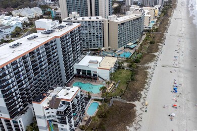 Bird's eye view featuring a city view and a beach 