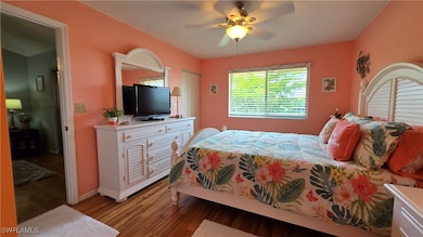 Bedroom featuring light wood-style flooring, baseb