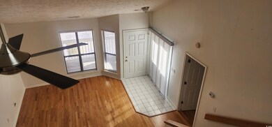 Entrance foyer with light hardwood / wood-style fl