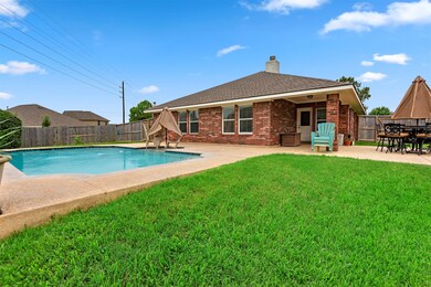 Large backyard with pool, covered patio, expanded patio area and plenty of green space left.