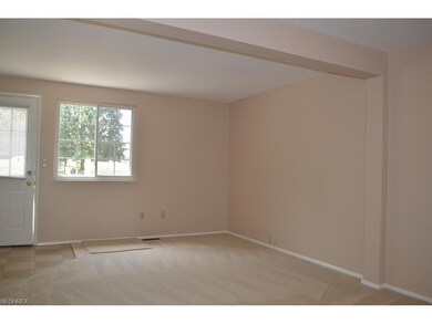 Bright great room opens to private enclosed patio.
