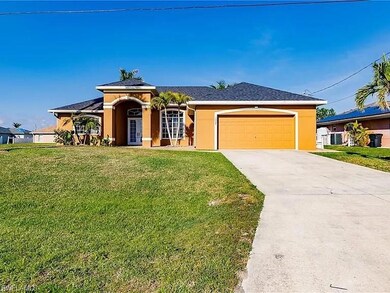 View of front of property with a garage and a fron