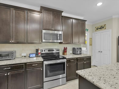 The electric range and built in mircowave are all ready for your home chef!