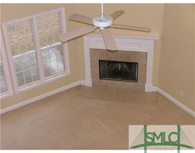 Living Room. View of the fireplace from the second
