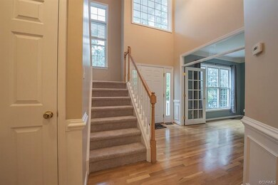 View of the 2-story foyer w/mulitpaned glass windo