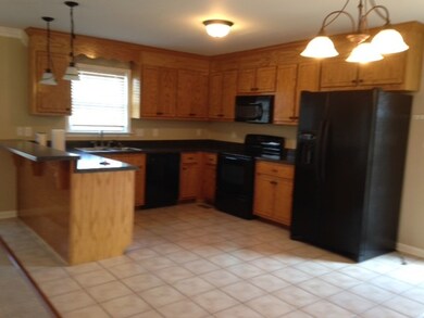 KITCHEN PART OF GREAT ROOM WITH CERAMIC FLOORING A