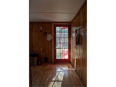 Mudroom. House front door into large...