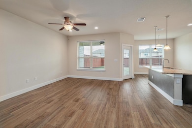 Unfurnished living room with visible vents, wood 
